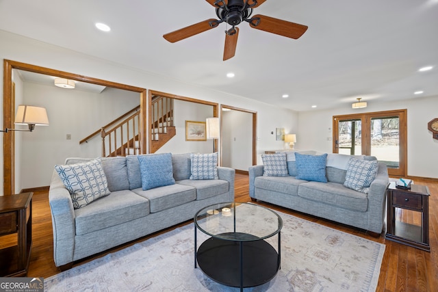 living area with recessed lighting, crown molding, stairway, and wood finished floors