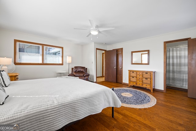 bedroom with a ceiling fan, crown molding, baseboards, and wood finished floors