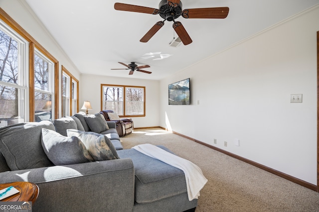 carpeted living area with visible vents, crown molding, and baseboards