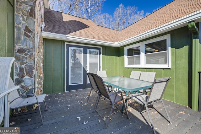 wooden terrace featuring outdoor dining area