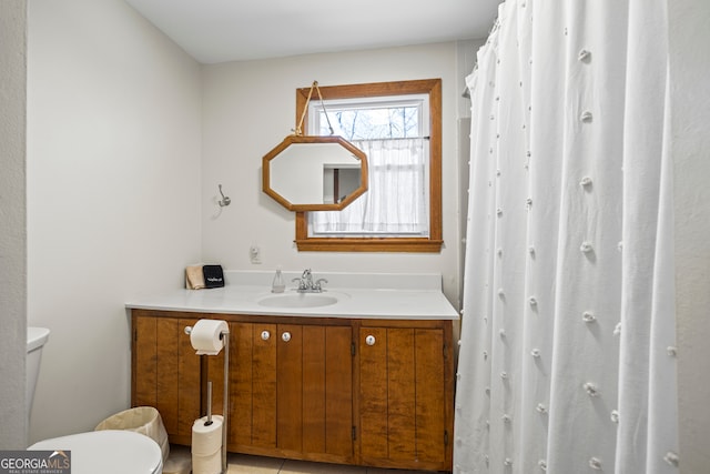 bathroom featuring vanity and toilet