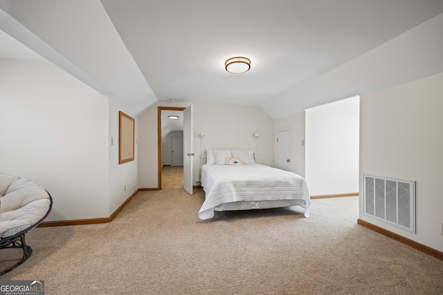 bedroom with carpet, visible vents, vaulted ceiling, and baseboards