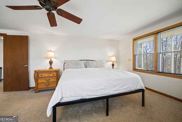 bedroom featuring carpet, baseboards, and ceiling fan