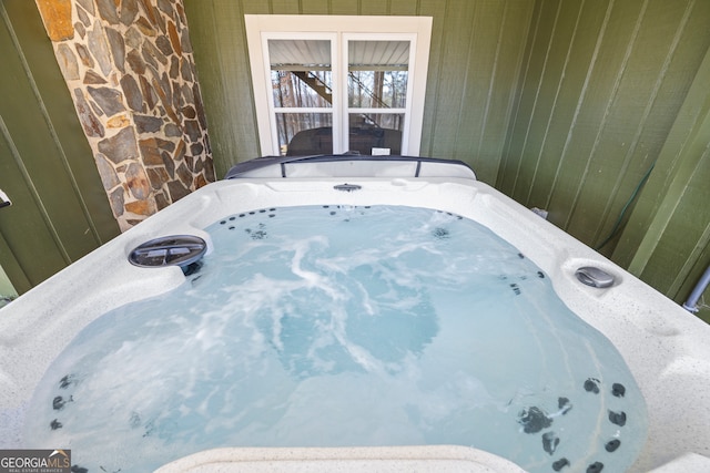 interior space with a jacuzzi