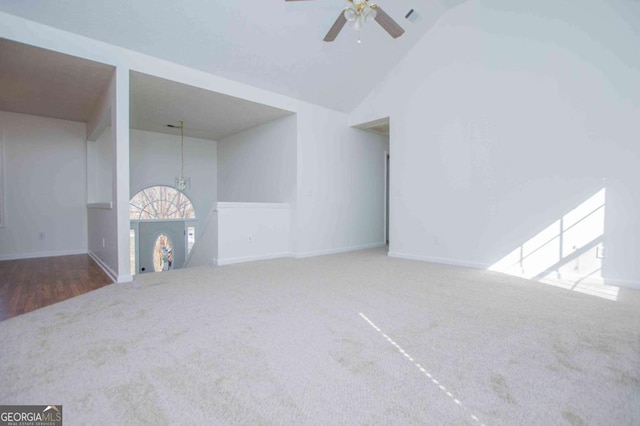 unfurnished living room with carpet floors, high vaulted ceiling, visible vents, and a ceiling fan