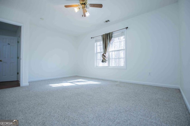 unfurnished room with a ceiling fan, baseboards, visible vents, and carpet flooring