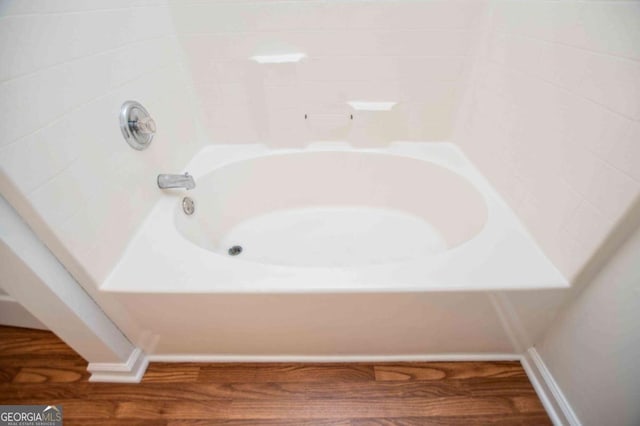 full bath featuring wood finished floors