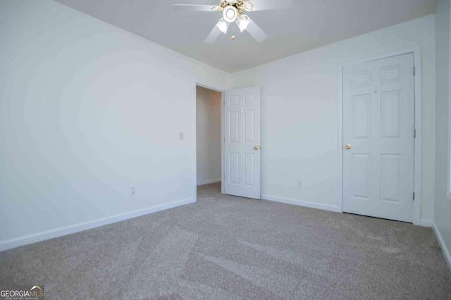 unfurnished bedroom with carpet floors, ceiling fan, and baseboards