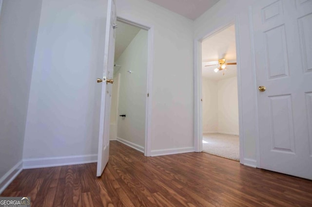 interior space with baseboards and wood finished floors