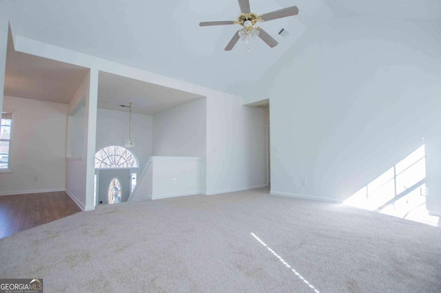 unfurnished living room with carpet, visible vents, and baseboards