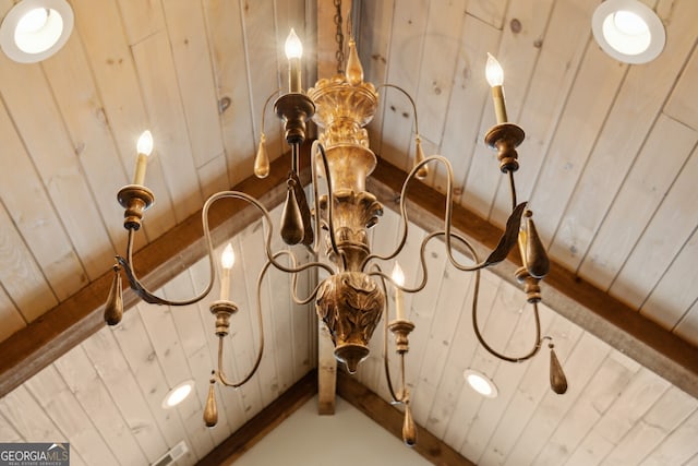 details featuring wood ceiling, wooden walls, and beamed ceiling