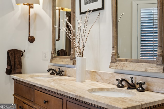 bathroom featuring double vanity and a sink