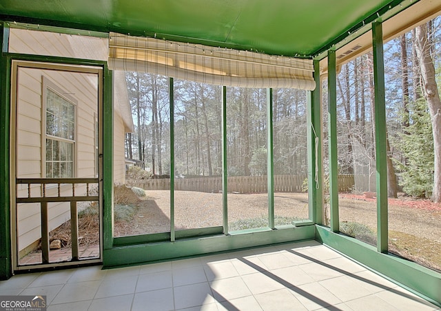 unfurnished sunroom featuring plenty of natural light