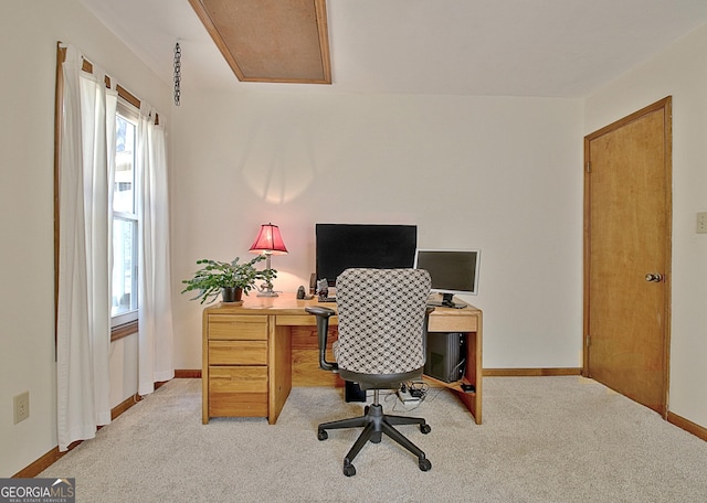 carpeted office with baseboards