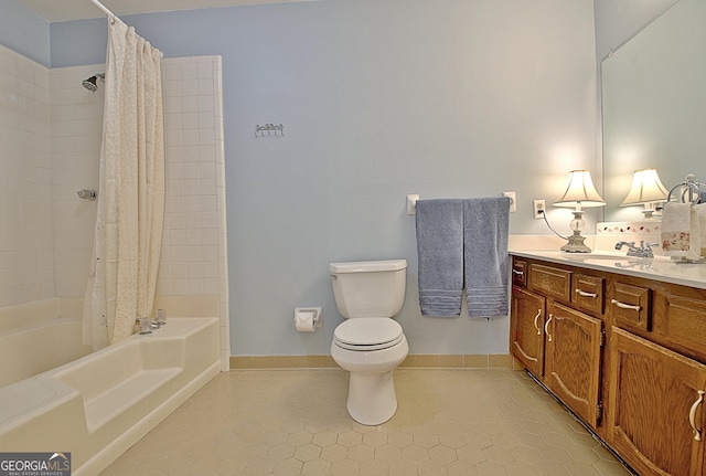 full bathroom with tile patterned flooring, toilet, vanity, baseboards, and shower / bath combo