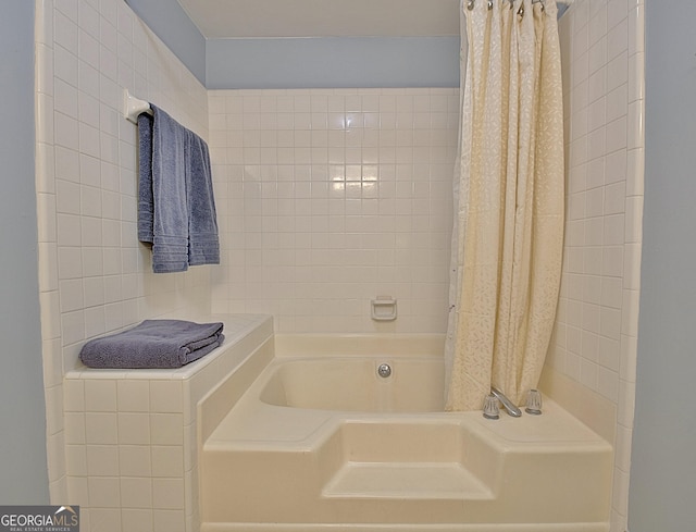 bathroom featuring shower / bathtub combination with curtain