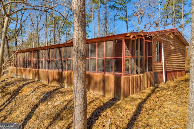 view of side of property featuring an outdoor structure