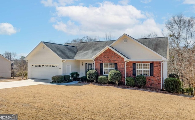 ranch-style home with an attached garage, a front lawn, concrete driveway, and brick siding