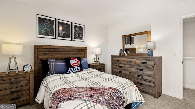 carpeted bedroom featuring baseboards