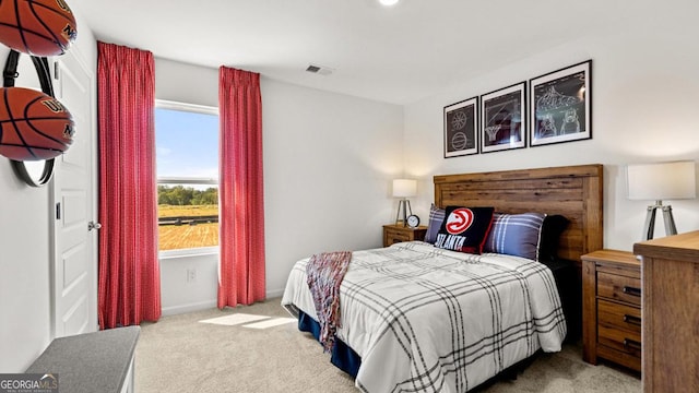 bedroom featuring carpet floors and visible vents