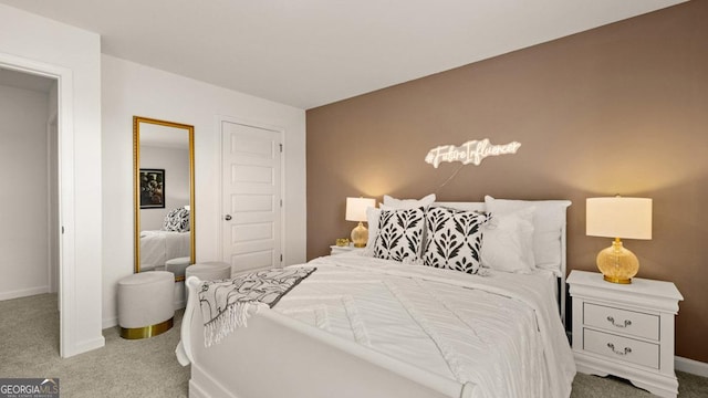 bedroom featuring carpet floors and baseboards