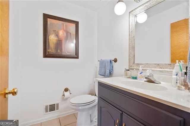 half bath with toilet, tile patterned flooring, visible vents, and vanity