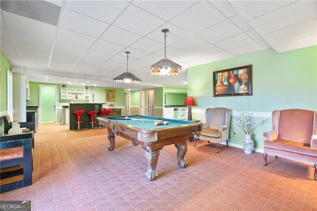 rec room with pool table, a bar, a paneled ceiling, and baseboards