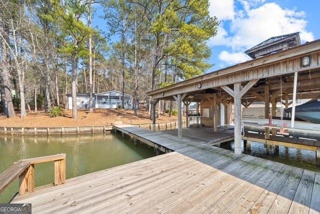 dock area featuring a water view and boat lift