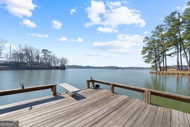 view of dock with a water view