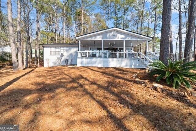view of front of house with a ceiling fan
