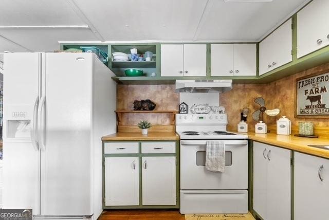 kitchen featuring under cabinet range hood, white appliances, white cabinets, light countertops, and open shelves