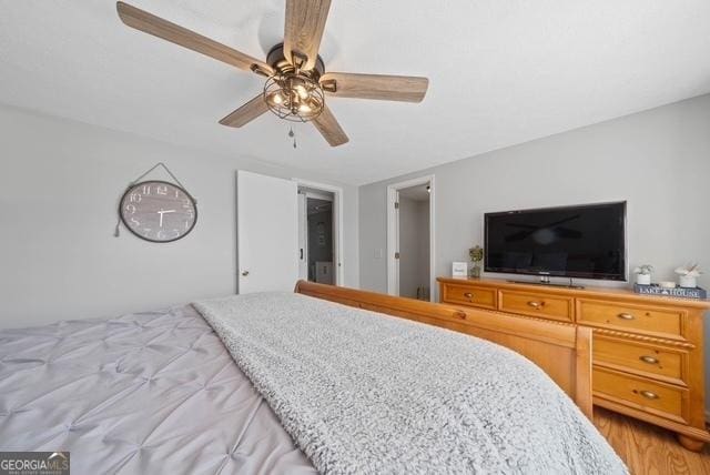 bedroom with ceiling fan and light wood-type flooring