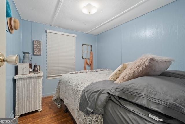 bedroom with wood finished floors