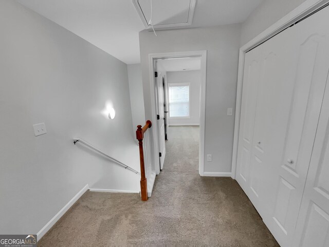 1235 Park Pass Way, Suwanee, GA 30024 - hallway with an upstairs landing, carpet flooring, attic access, and baseboards