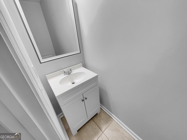 1235 Park Pass Way, Suwanee, GA 30024 - bathroom with vanity, baseboards, and tile patterned floors