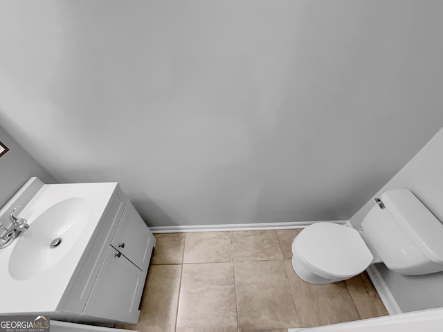 1235 Park Pass Way, Suwanee, GA 30024 - half bathroom with tile patterned flooring, baseboards, vanity, and toilet