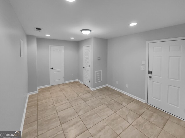 1235 Park Pass Way, Suwanee, GA 30024 - unfurnished room with light tile patterned floors, visible vents, baseboards, and recessed lighting