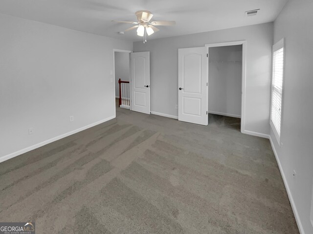 1235 Park Pass Way, Suwanee, GA 30024 - unfurnished bedroom featuring carpet, a closet, visible vents, and baseboards