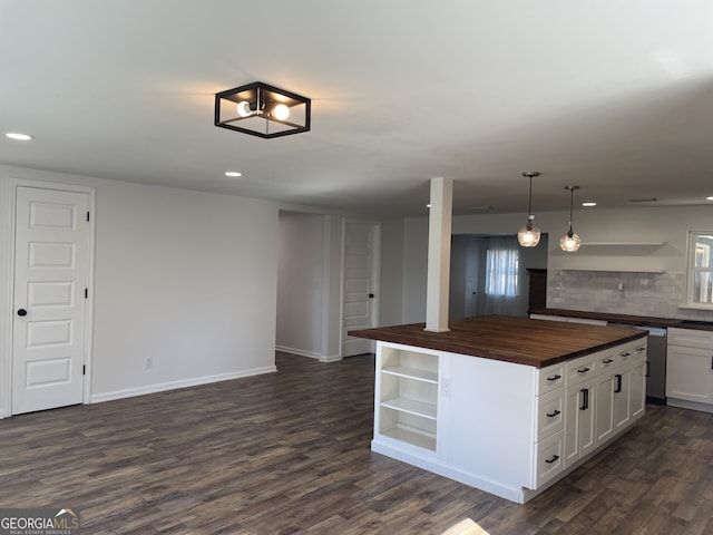 kitchen with open shelves, butcher block counters, backsplash, and dark wood finished floors