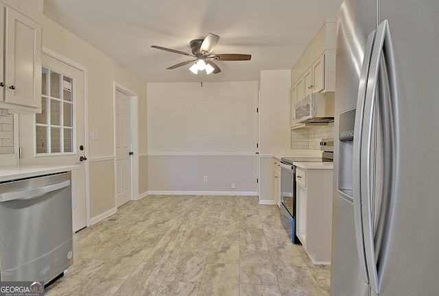 kitchen featuring ceiling fan, baseboards, light countertops, appliances with stainless steel finishes, and tasteful backsplash