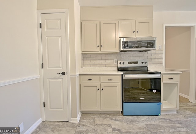 kitchen featuring backsplash, baseboards, stainless steel appliances, and light countertops