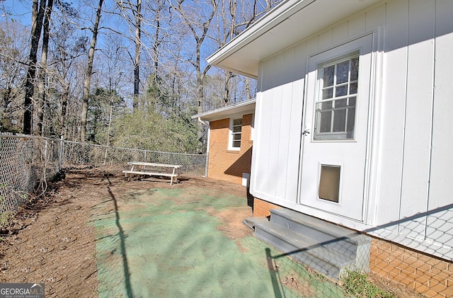 view of yard featuring entry steps, a patio, and a fenced backyard