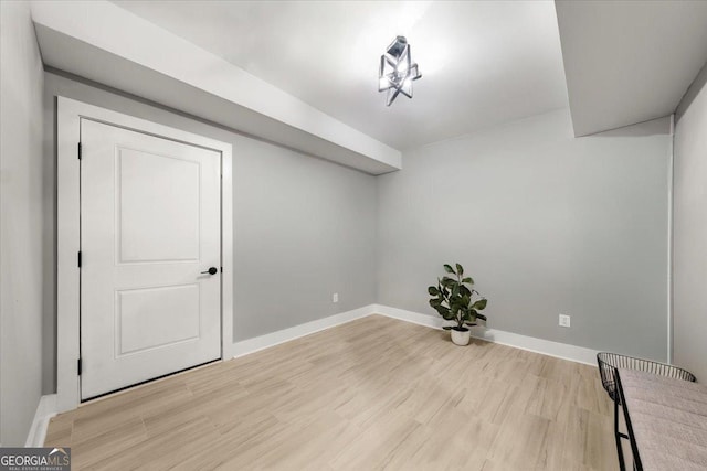 interior space with light wood-style flooring and baseboards