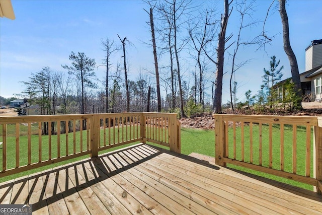 wooden deck with a lawn