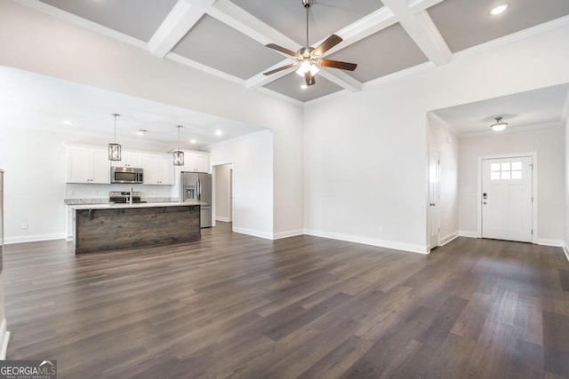 unfurnished living room with dark wood-style floors, ceiling fan, baseboards, and coffered ceiling