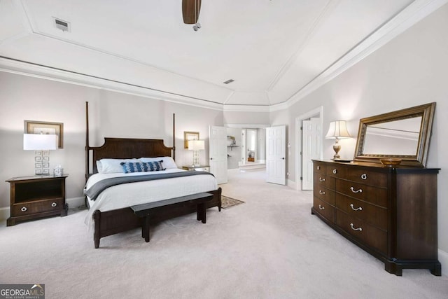 bedroom with light carpet, vaulted ceiling, visible vents, and crown molding