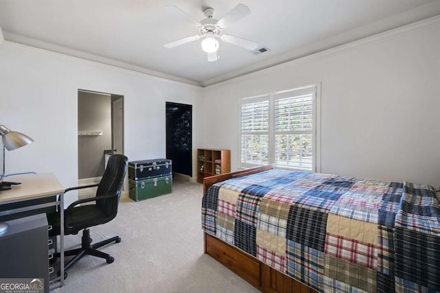 carpeted bedroom featuring ceiling fan, ornamental molding, and visible vents