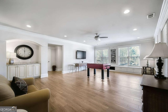 rec room featuring ornamental molding, light wood finished floors, visible vents, and recessed lighting