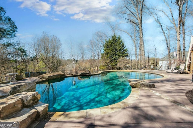 outdoor pool with a patio