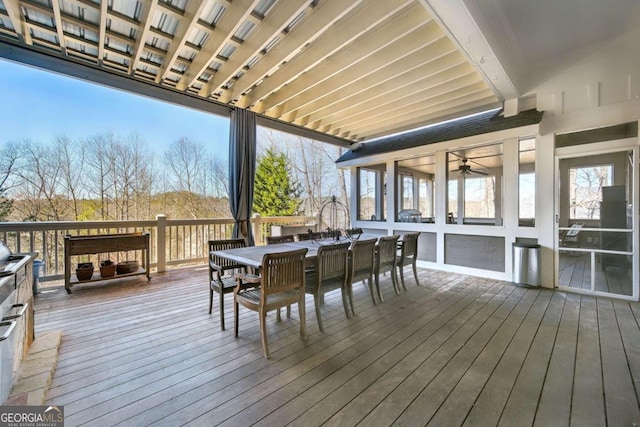 wooden terrace with outdoor dining space